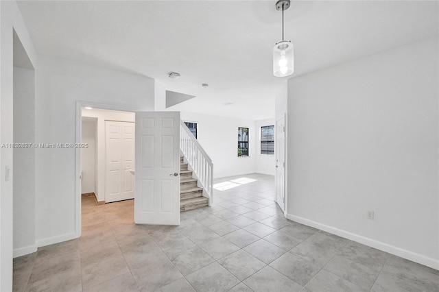5013 Vulcan Way, Davie, FL 33314 - spare room featuring stairs and light tile patterned flooring