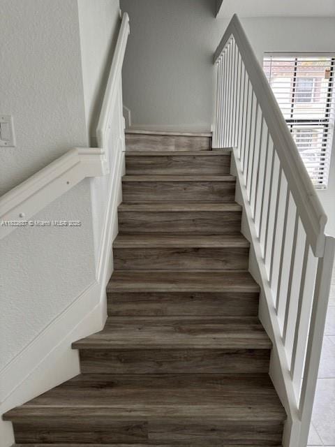 5013 Vulcan Way, Davie, FL 33314 - staircase with wood finished floors and a textured wall