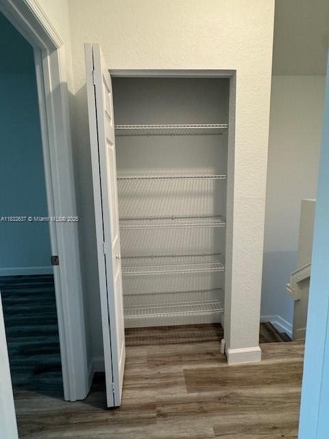 5013 Vulcan Way, Davie, FL 33314 - detailed view of wood finished floors and baseboards