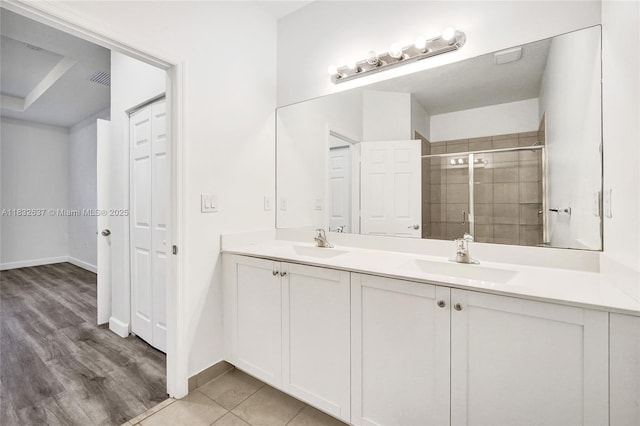 5013 Vulcan Way, Davie, FL 33314 - full bath with double vanity, a shower stall, a closet, and wood finished floors