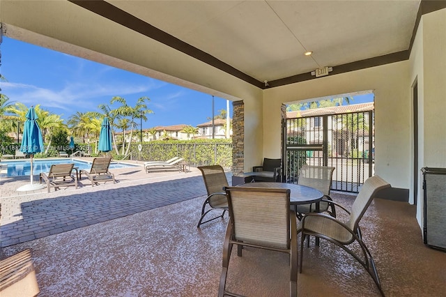 5013 Vulcan Way, Davie, FL 33314 - view of patio / terrace featuring a community pool