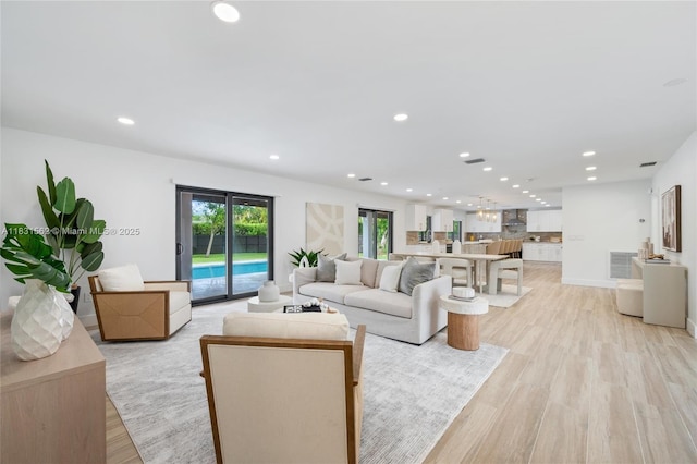 10704 SW 133rd Ter, Miami, FL 33176 - living area featuring recessed lighting and light wood-style flooring