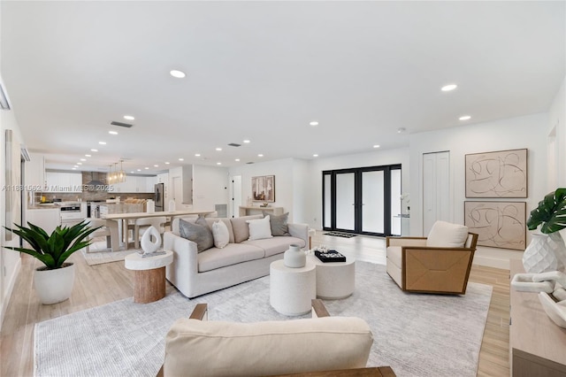 10704 SW 133rd Ter, Miami, FL 33176 - living area with light wood-type flooring and recessed lighting