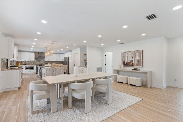 10704 SW 133rd Ter, Miami, FL 33176 - dining space with recessed lighting and light wood-style floors