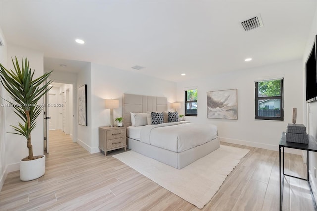 10704 SW 133rd Ter, Miami, FL 33176 - bedroom featuring multiple windows, light wood-style flooring, and recessed lighting