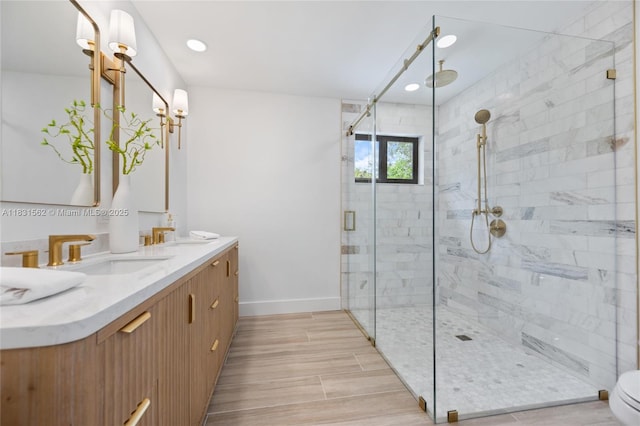 10704 SW 133rd Ter, Miami, FL 33176 - bathroom with a stall shower, double vanity, recessed lighting, and wood finished floors