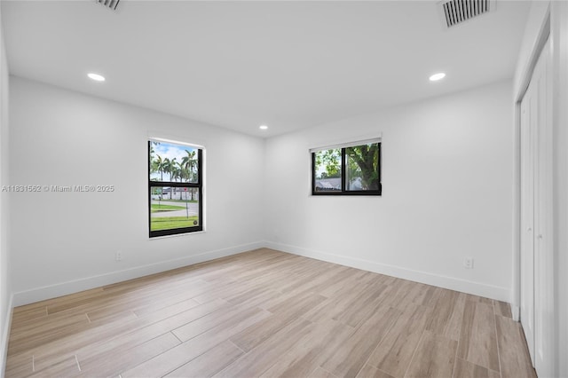 10704 SW 133rd Ter, Miami, FL 33176 - spare room with plenty of natural light, light wood-style flooring, and recessed lighting
