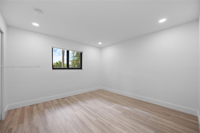 10704 SW 133rd Ter, Miami, FL 33176 - empty room featuring light wood-type flooring, recessed lighting, and a smoke detector