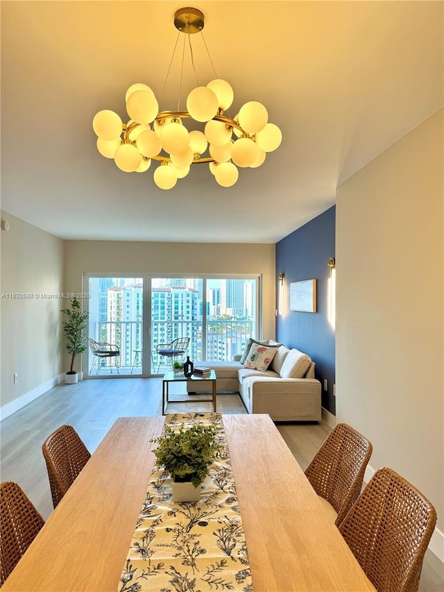 300 Bayview Dr Unit 1801, Sunny Isles Beach, FL 33160 - dining space featuring a chandelier and wood finished floors