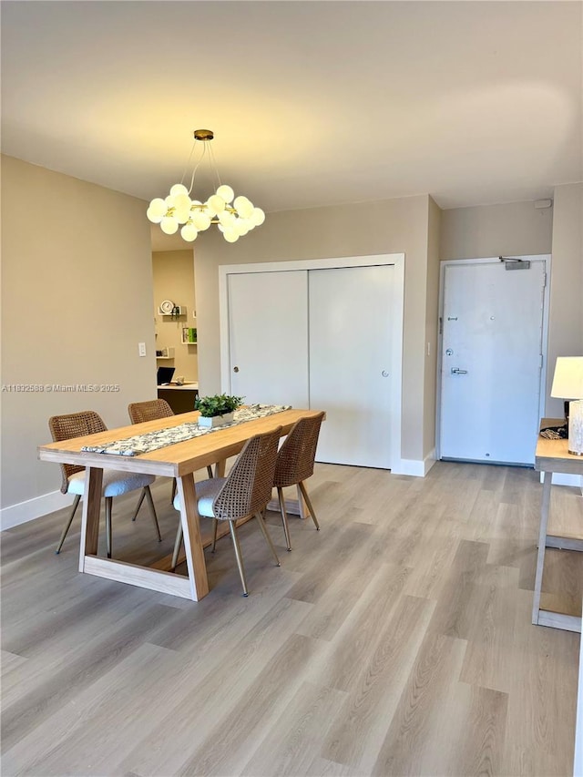 300 Bayview Dr Unit 1801, Sunny Isles Beach, FL 33160 - dining space with light wood finished floors and a chandelier