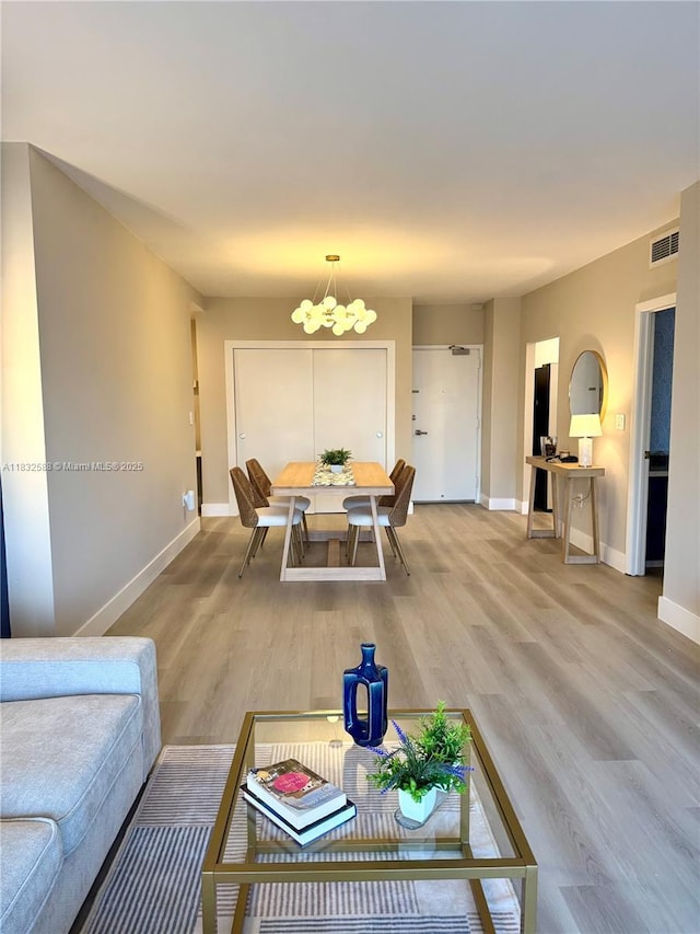 300 Bayview Dr Unit 1801, Sunny Isles Beach, FL 33160 - living area with a chandelier and wood finished floors