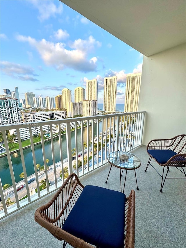 300 Bayview Dr Unit 1801, Sunny Isles Beach, FL 33160 - balcony with a water view and a view of skyline