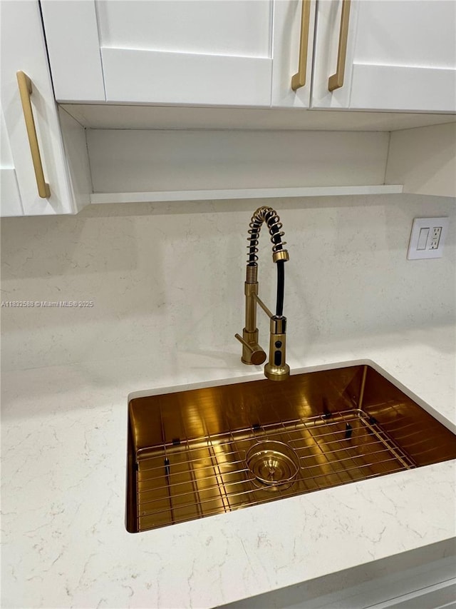 300 Bayview Dr Unit 1801, Sunny Isles Beach, FL 33160 - kitchen view of white cabinets and light stone countertops