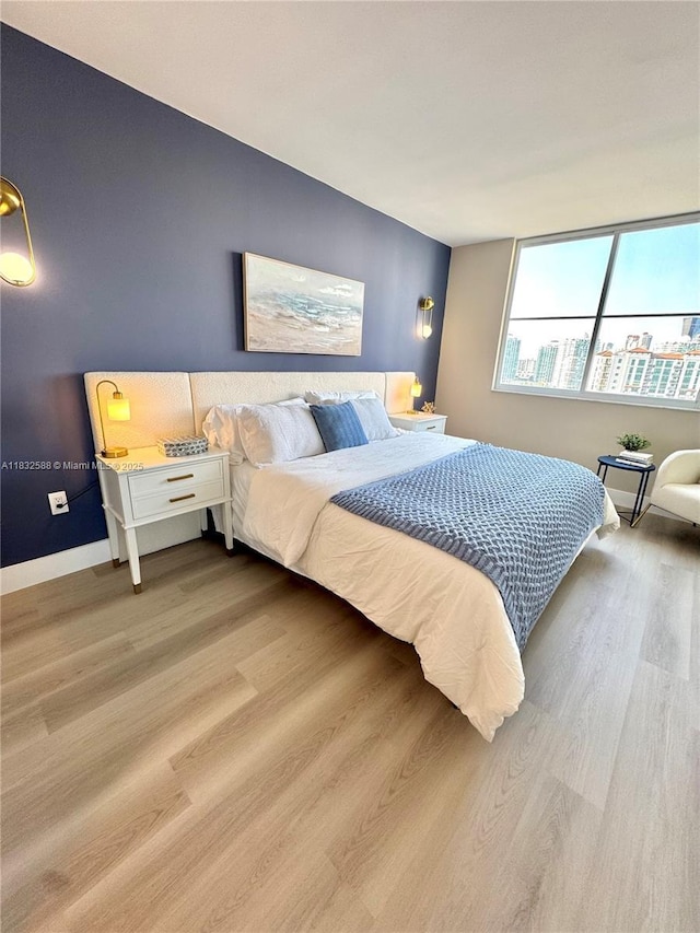 300 Bayview Dr Unit 1801, Sunny Isles Beach, FL 33160 - bedroom with wood finished floors and baseboards