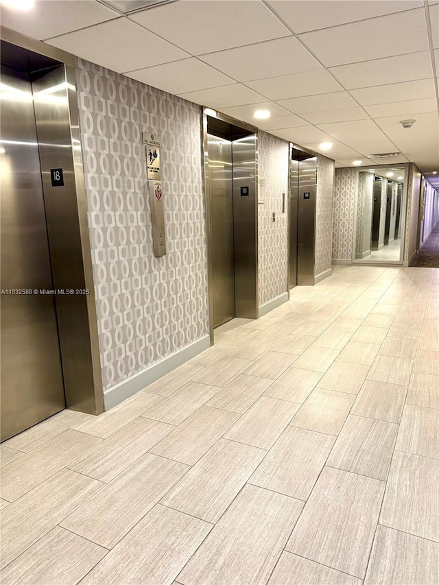 300 Bayview Dr Unit 1801, Sunny Isles Beach, FL 33160 - common area with a drop ceiling and wallpapered walls
