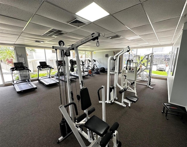 300 Bayview Dr Unit 1801, Sunny Isles Beach, FL 33160 - gym featuring a paneled ceiling and carpet floors