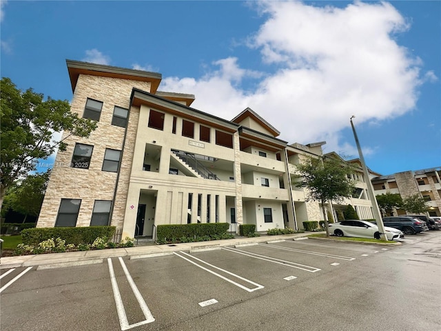 8031 NW 104th Ave Unit 21, Doral, FL 33178 - view of apartment building / complex with uncovered parking