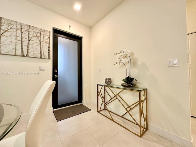 8031 NW 104th Ave Unit 21, Doral, FL 33178 - entrance foyer with baseboards and light tile patterned floors