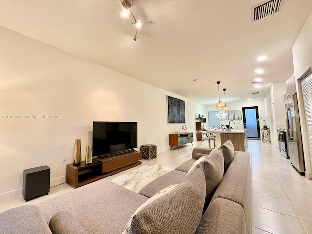 8031 NW 104th Ave Unit 21, Doral, FL 33178 - living room with light tile patterned floors