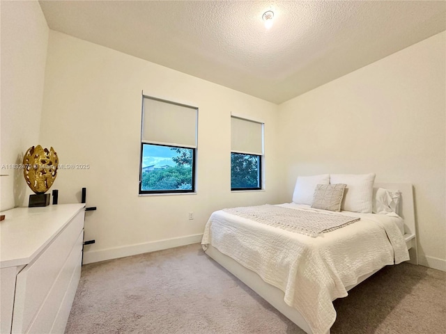 8031 NW 104th Ave Unit 21, Doral, FL 33178 - bedroom featuring light carpet and a textured ceiling