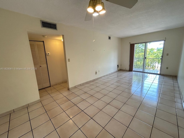 3181 SW 13th St Unit 401, Miami, FL 33145 - empty room with a ceiling fan, a textured ceiling, and light tile patterned floors