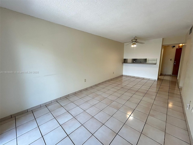 3181 SW 13th St Unit 401, Miami, FL 33145 - empty room featuring ceiling fan, light tile patterned floors, and a textured ceiling