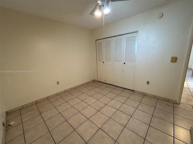 3181 SW 13th St Unit 401, Miami, FL 33145 - unfurnished bedroom featuring light tile patterned flooring, a closet, and ceiling fan