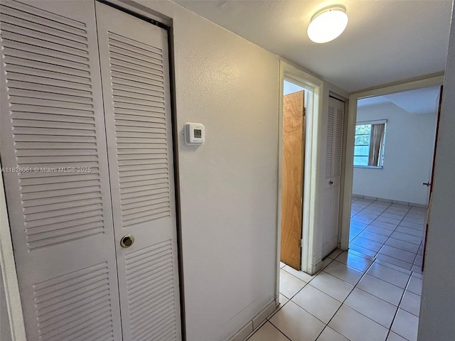 3181 SW 13th St Unit 401, Miami, FL 33145 - hallway featuring light tile patterned flooring
