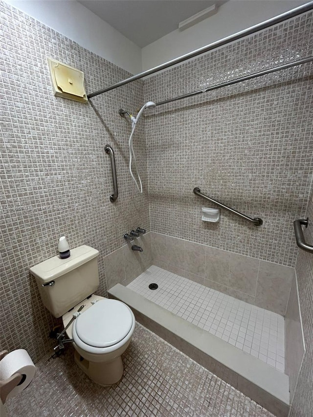 3181 SW 13th St Unit 401, Miami, FL 33145 - full bath with a shower stall, tile patterned floors, and tile walls