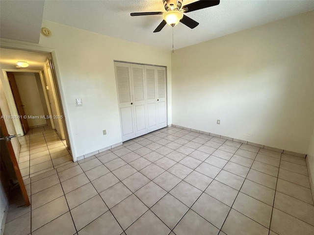 3181 SW 13th St Unit 401, Miami, FL 33145 - unfurnished bedroom featuring a closet, light tile patterned floors, and ceiling fan