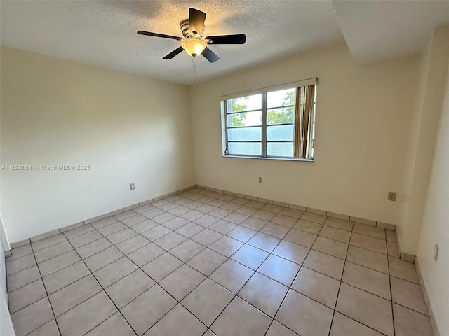 3181 SW 13th St Unit 401, Miami, FL 33145 - spare room featuring a textured ceiling, ceiling fan, and light tile patterned floors