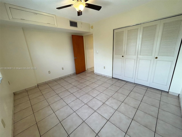 3181 SW 13th St Unit 401, Miami, FL 33145 - unfurnished bedroom featuring a closet, light tile patterned flooring, and a ceiling fan