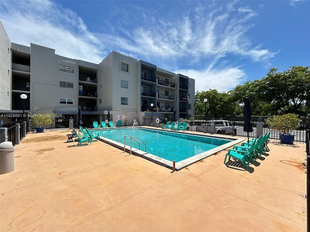 3181 SW 13th St Unit 401, Miami, FL 33145 - community pool featuring a patio