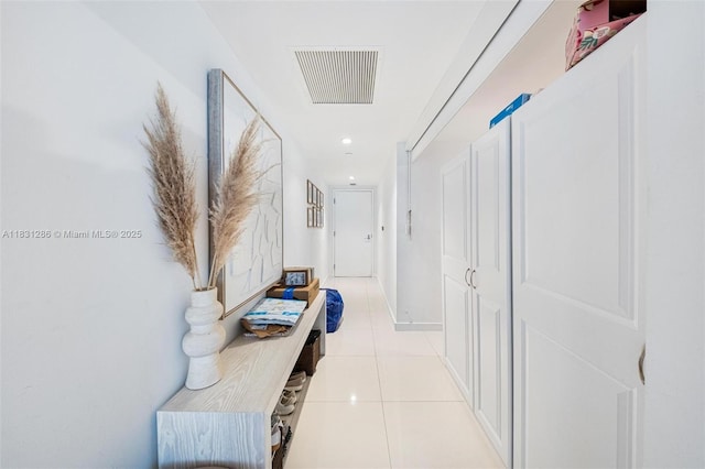 9940 W Bay Harbor Dr Unit 4B-S, Bay Harbor Islands, FL 33154 - corridor with light tile patterned flooring and recessed lighting