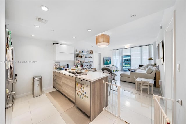 9940 W Bay Harbor Dr Unit 4B-S, Bay Harbor Islands, FL 33154 - kitchen featuring modern cabinets, dishwasher, a peninsula, light tile patterned flooring, and light countertops