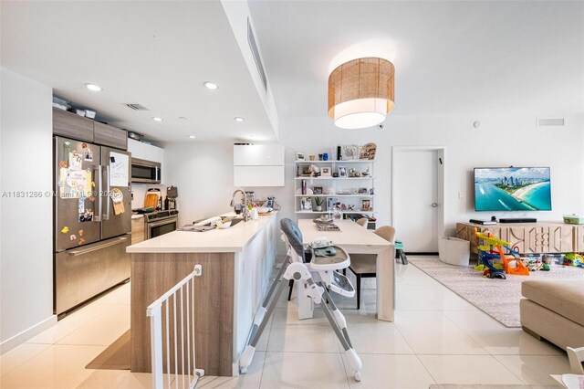 9940 W Bay Harbor Dr Unit 4B-S, Bay Harbor Islands, FL 33154 - kitchen featuring appliances with stainless steel finishes, modern cabinets, open floor plan, light countertops, and recessed lighting