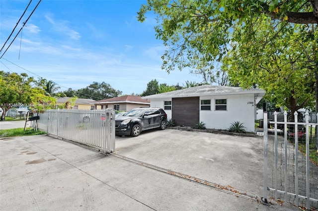 2788 NW 48th St, Miami, FL 33142 - view of parking with a gate