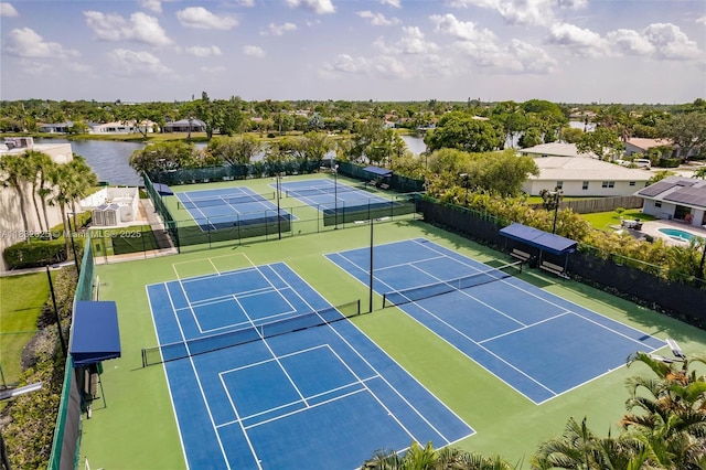 23 Simonton Cir, Weston, FL 33326 - view of tennis court featuring a water view and a residential view