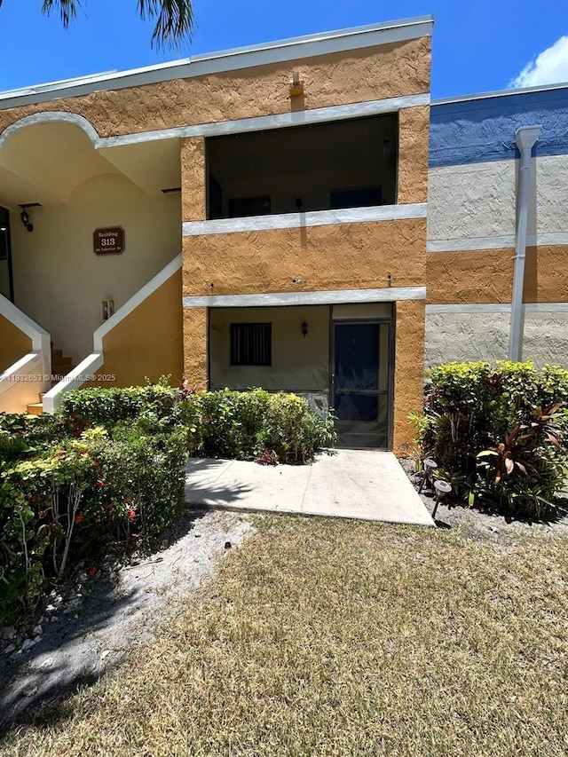 189 Lakeview Dr Unit 103, Weston, FL 33326 - back of house featuring stucco siding