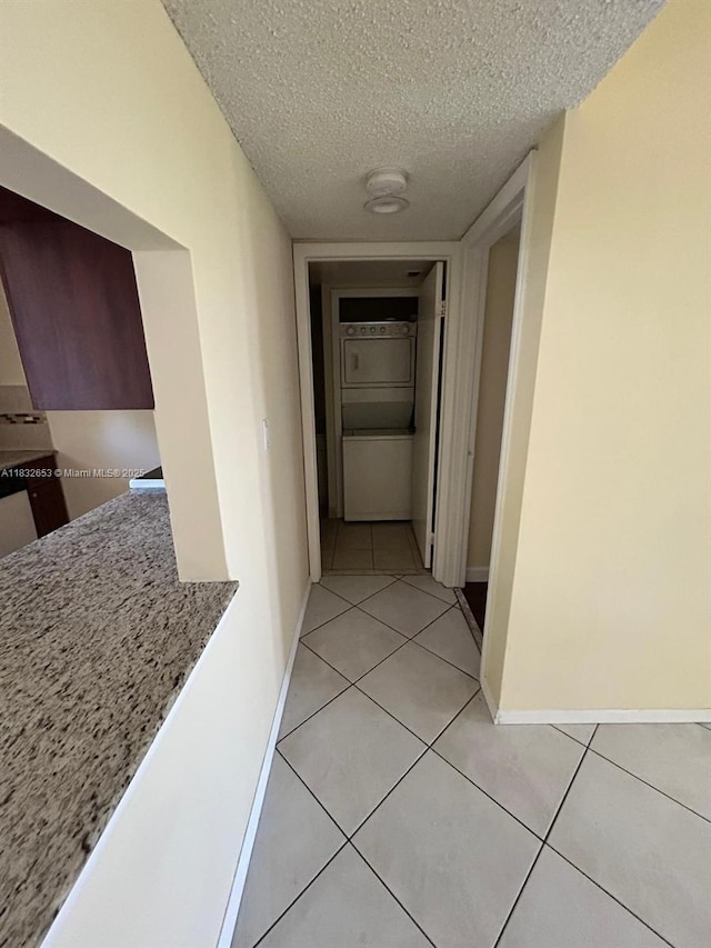 189 Lakeview Dr Unit 103, Weston, FL 33326 - corridor with a textured ceiling and light tile patterned floors