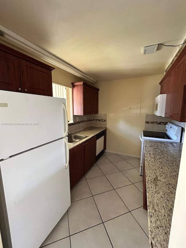 189 Lakeview Dr Unit 103, Weston, FL 33326 - kitchen with white appliances, light tile patterned floors, and tasteful backsplash