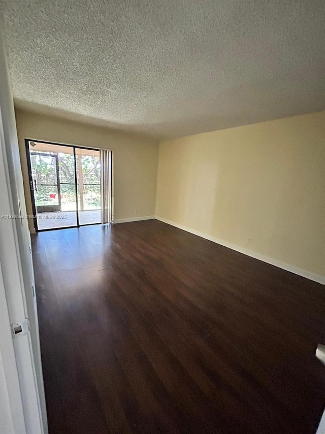 189 Lakeview Dr Unit 103, Weston, FL 33326 - unfurnished room with dark wood-style flooring and a textured ceiling