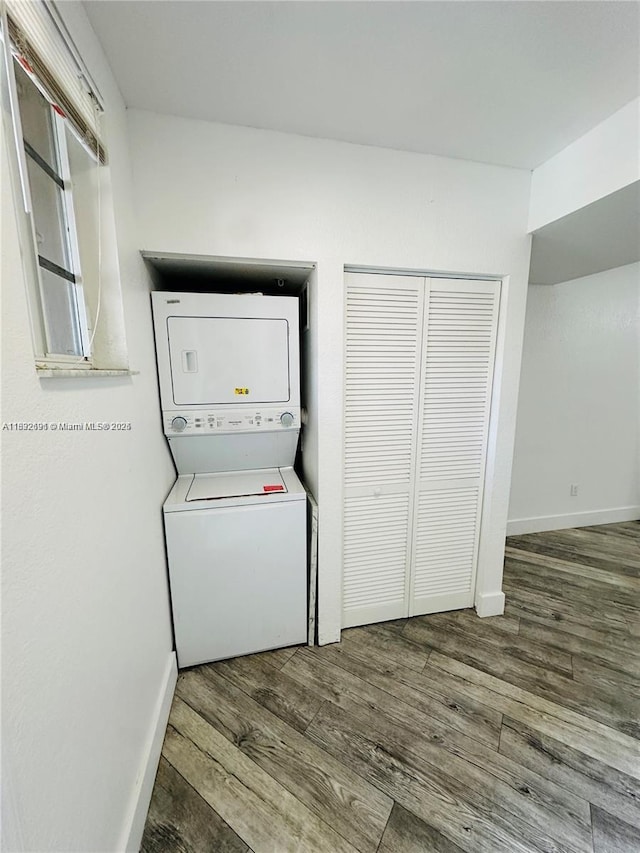 1962 Freeport Ln Unit 1962, Riviera Beach, FL 33404 - laundry area with stacked washer / dryer and wood finished floors