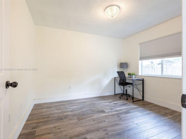 581 SW 169th Way, Weston, FL 33326 - office area featuring wood finished floors and a textured ceiling