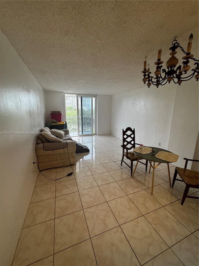 16851 NE 23rd Ave Unit A516, North Miami Beach, FL 33160 - living area featuring a textured ceiling and a chandelier