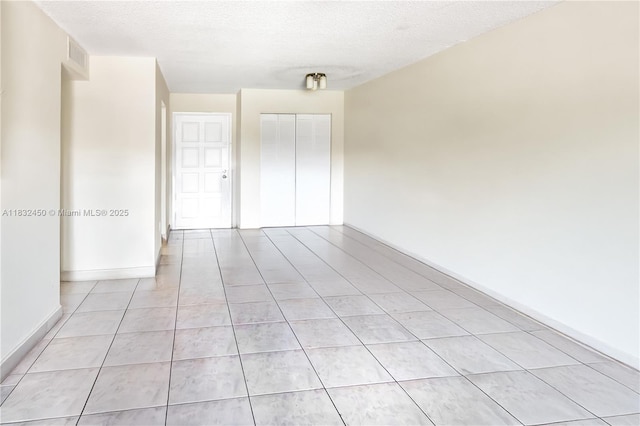 1755 W 60th St Unit D206, Hialeah, FL 33012 - empty room featuring light tile patterned floors and a textured ceiling