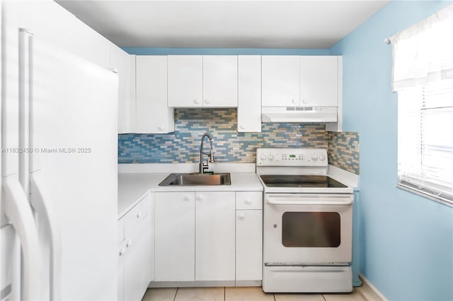 1755 W 60th St Unit D206, Hialeah, FL 33012 - kitchen featuring white appliances, under cabinet range hood, light countertops, and decorative backsplash