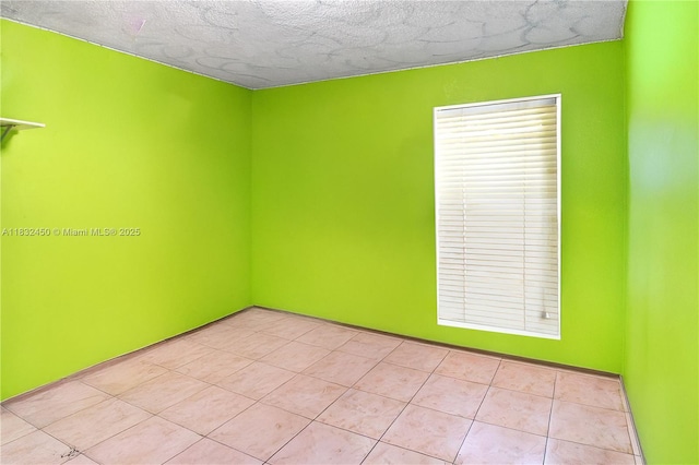 1755 W 60th St Unit D206, Hialeah, FL 33012 - spare room featuring a textured ceiling and light tile patterned floors