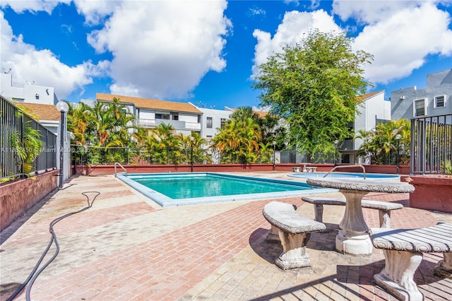 1755 W 60th St Unit D206, Hialeah, FL 33012 - community pool featuring a patio area and a residential view
