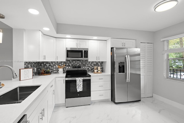 12500 SW 6th St Unit 206N, Pembroke Pines, FL 33027 - kitchen with stainless steel appliances, recessed lighting, decorative backsplash, white cabinetry, and light countertops